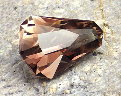 4.34 ct Dichroic Oregon Sunstone in Arya Akhavan PANA MINE-SUNSET BELL design, rough from PANA Mine, 2018