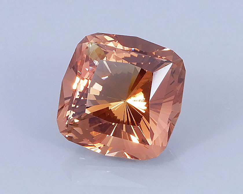 9.69 ct Peach-Copper Oregon Sunstone in Fancy Cushion with 32 Pavilion Main Facets, Rough from Sunstone Butte Mine