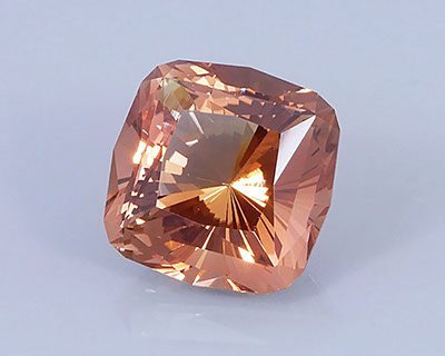9.69 ct Peach-Copper Oregon Sunstone in Fancy Cushion with 32 Pavilion Main Facets, Rough from Sunstone Butte Mine