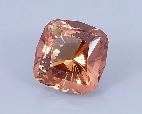 9.69 ct Peach-Copper Oregon Sunstone in Fancy Cushion with 32 Pavilion Main Facets, Rough from Sunstone Butte Mine