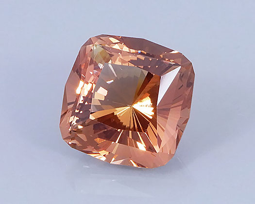 9.69 ct Peach-Copper Oregon Sunstone in Fancy Cushion with 32 Pavilion Main Facets, Rough from Sunstone Butte Mine